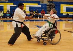 Martial artist in wheelchair practices