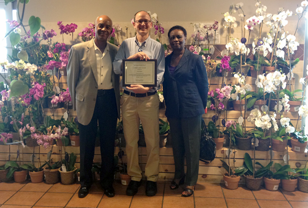 Stael Exantus and Sam Patterson presenting the Employer Appreciation Award to Mike Paholik with Fresh Market