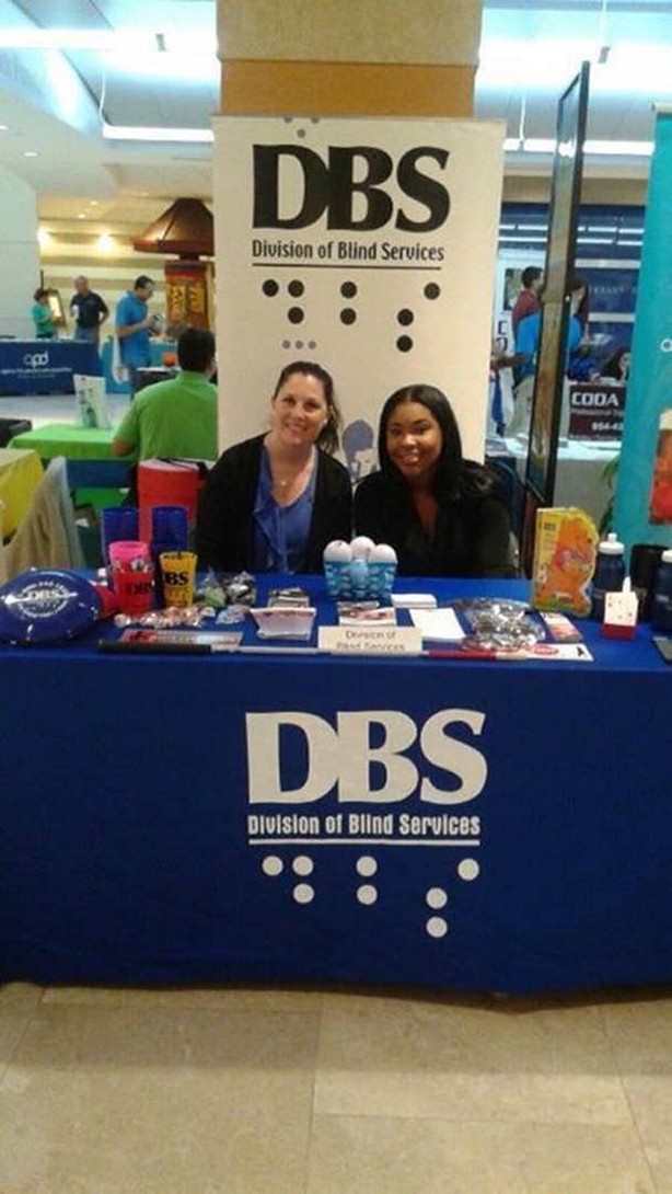 Vanessa Charles and Linda Hernandez the DBS exhibit table during the Nova Southeastern University Disability Expo