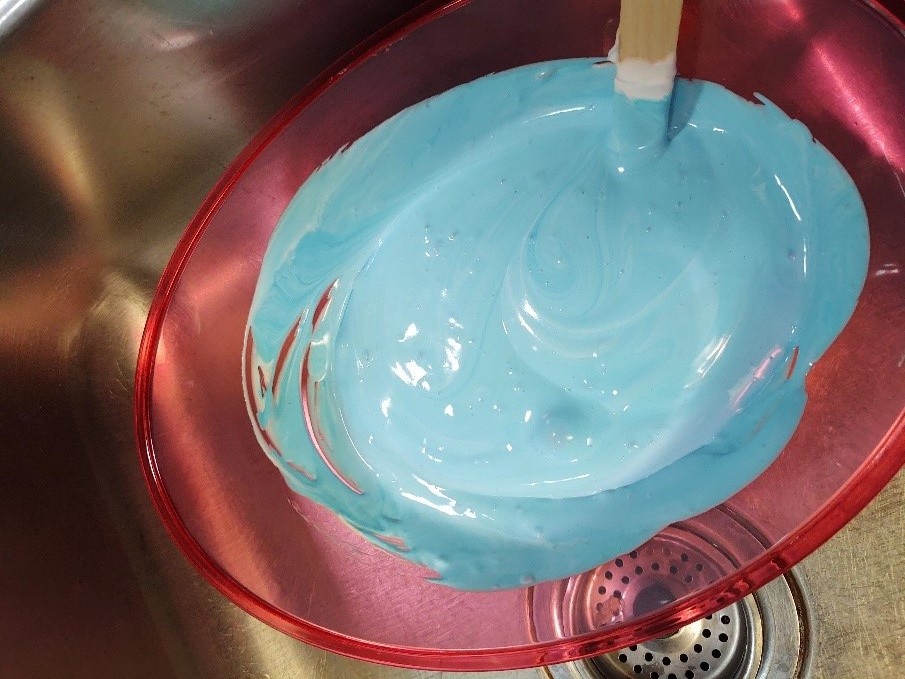 Blue food coloring added to mixture.